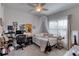 Bright bedroom with bed, desk, and window at 424 Luna Bella Ln # 222, New Smyrna Beach, FL 32168