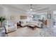 Open concept living room with white sectional and wood coffee table at 424 Luna Bella Ln # 222, New Smyrna Beach, FL 32168