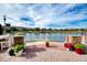 Relaxing patio area with lake view and stone accents at 424 Luna Bella Ln # 222, New Smyrna Beach, FL 32168