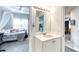 Small bathroom with vanity and view of bedroom at 424 Luna Bella Ln # 222, New Smyrna Beach, FL 32168