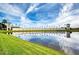 Venetian Bay community entrance with a reflecting pool and palm trees at 424 Luna Bella Ln # 222, New Smyrna Beach, FL 32168