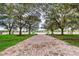 Brick pathway leads to a lakefront view with benches at 424 Luna Bella Ln # 222, New Smyrna Beach, FL 32168