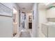 Bright laundry room with washer, dryer, and extra storage at 424 Luna Bella Ln # 222, New Smyrna Beach, FL 32168