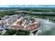Aerial view showing condo community near lake, highlighting building location and surroundings at 424 Luna Bella Ln # 222, New Smyrna Beach, FL 32168