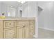 Light wood vanity with granite countertop in bathroom at 2200 N Atlantic Ave # 1602, Daytona Beach, FL 32118