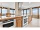 Modern kitchen with granite counters, stainless steel appliances, and ocean views at 2200 N Atlantic Ave # 1602, Daytona Beach, FL 32118