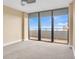 Serene bedroom with sliding doors to balcony and ocean view at 2200 N Atlantic Ave # 1602, Daytona Beach, FL 32118