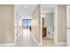 Bright hallway with access to multiple rooms and a bathroom at 2200 N Atlantic Ave # 1602, Daytona Beach, FL 32118
