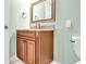 Guest bathroom with wood vanity and granite countertop at 2200 N Atlantic Ave # 1602, Daytona Beach, FL 32118