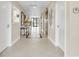 Well-lit hallway with tile floors and elevator access at 2200 N Atlantic Ave # 1602, Daytona Beach, FL 32118