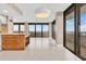 Bright dining area with ocean views and modern light fixture at 2200 N Atlantic Ave # 1602, Daytona Beach, FL 32118