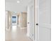 Bright hallway with tile floors and access to other rooms at 2200 N Atlantic Ave # 1602, Daytona Beach, FL 32118