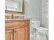 Guest bathroom with wood vanity and granite countertop at 2200 N Atlantic Ave # 1602, Daytona Beach, FL 32118