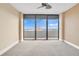 Spacious bedroom with balcony access and ocean views at 2200 N Atlantic Ave # 1602, Daytona Beach, FL 32118