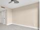 Spacious bedroom with a ceiling fan and neutral color palette at 2200 N Atlantic Ave # 1602, Daytona Beach, FL 32118