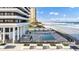 Community pool with ocean views and lounge chairs at 2200 N Atlantic Ave # 1602, Daytona Beach, FL 32118