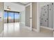 Open living area with ocean view and access to balcony at 2200 N Atlantic Ave # 1602, Daytona Beach, FL 32118