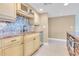 Kitchen with light wood cabinets, granite counters, and mosaic backsplash at 2200 N Atlantic Ave # 1602, Daytona Beach, FL 32118
