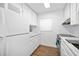 White kitchen boasts stainless steel appliances and marble countertops at 1510 Ocean Shore Blvd # 3150, Ormond Beach, FL 32176