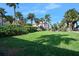 Lush green backyard with tropical landscaping at 1510 Ocean Shore Blvd # 3150, Ormond Beach, FL 32176