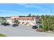 Aerial view of an apartment building with parking and surrounding landscape at 1510 Ocean Shore Blvd # 3150, Ormond Beach, FL 32176