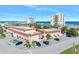 Aerial view of an oceanfront condominium complex with ample parking and ocean views at 1510 Ocean Shore Blvd # 3150, Ormond Beach, FL 32176
