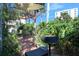 Brick patio with seating, fountain, and shade sail at 1510 Ocean Shore Blvd # 3150, Ormond Beach, FL 32176