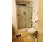 Clean bathroom with shower, toilet, and tiled floor at 216 Rue De Paresse, Tavares, FL 32778