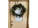 Inviting front door adorned with a unique antler wreath at 216 Rue De Paresse, Tavares, FL 32778