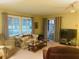 Spacious living room with ample natural light and comfortable seating at 216 Rue De Paresse, Tavares, FL 32778