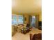Spacious living room with ample natural light and comfortable seating at 216 Rue De Paresse, Tavares, FL 32778