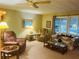 Cozy living room with ample seating and soft carpeting at 216 Rue De Paresse, Tavares, FL 32778