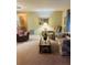 Living room with comfortable seating and a large mirror at 216 Rue De Paresse, Tavares, FL 32778