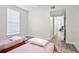 Bedroom with two twin beds, showing access to another room at 280 Celebration Blvd # 203, Celebration, FL 34747