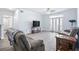 Bright living room featuring hardwood floors and ample natural light at 280 Celebration Blvd # 203, Celebration, FL 34747