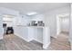 Open concept kitchen boasting stainless steel appliances and breakfast bar at 280 Celebration Blvd # 203, Celebration, FL 34747