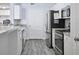 Modern kitchen with stainless steel appliances and white cabinets at 280 Celebration Blvd # 203, Celebration, FL 34747