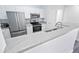 Modern kitchen with stainless steel appliances and granite countertops at 280 Celebration Blvd # 203, Celebration, FL 34747