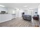 Spacious living room with open kitchen and gray couch at 280 Celebration Blvd # 203, Celebration, FL 34747