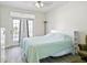Main bedroom with a queen bed and access to a balcony at 280 Celebration Blvd # 203, Celebration, FL 34747