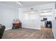 Open living room with gray couch and wood floors at 280 Celebration Blvd # 203, Celebration, FL 34747