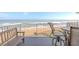 Balcony with ocean view, table and chairs, and bench at 1183 Ocean Shore Blvd # 6040, Ormond Beach, FL 32176