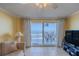 Living room with ocean view, featuring balcony access and comfy seating at 1183 Ocean Shore Blvd # 6040, Ormond Beach, FL 32176