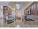 Granite countertops, stainless steel appliances, and ample cabinetry in this well-equipped kitchen at 1183 Ocean Shore Blvd # 6040, Ormond Beach, FL 32176