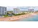 Aerial view of oceanfront building with beach access and nearby amenities at 1183 Ocean Shore Blvd # 6040, Ormond Beach, FL 32176