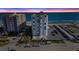 Aerial view of Regency Plaza at sunset, showcasing the oceanfront location at 1415 Ocean Shore Blvd # B030, Ormond Beach, FL 32176