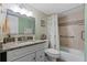 Updated bathroom with granite vanity and walk-in shower at 1415 Ocean Shore Blvd # B030, Ormond Beach, FL 32176