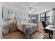 Spacious bedroom with coastal decor and ample closet space at 1415 Ocean Shore Blvd # B030, Ormond Beach, FL 32176