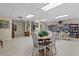 Bright community room with tables and chairs at 1415 Ocean Shore Blvd # B030, Ormond Beach, FL 32176