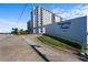 Regency Plaza, 1415: Building exterior view with landscaping and signage at 1415 Ocean Shore Blvd # B030, Ormond Beach, FL 32176